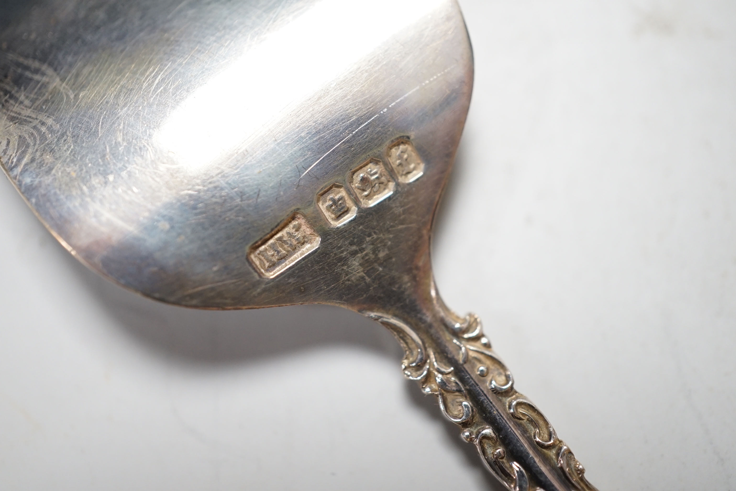 A pair of George V silver mounted cut glass scent bottles, London 1920, 11cm, a similar toilet jar, a hair tidy and a cased two piece christening set